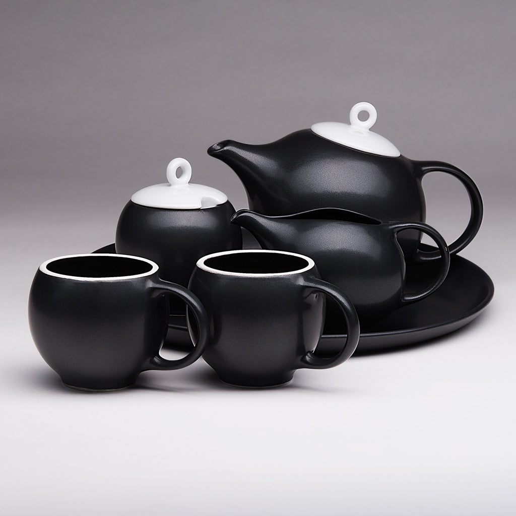 Modern teapot design. Black & white ceramic. A tribute to Eva Zeisel.